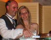 Bob and Christine cutting the cake
