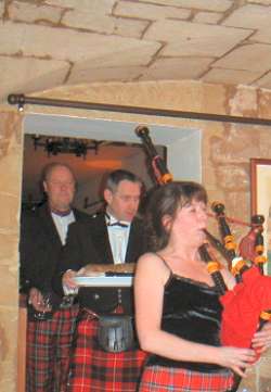 Maggie piping in the haggis with Shep and Steve at the Auld Alliance in Paris France
