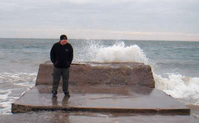 John braving the waves on Douglas prom, Isle of Man