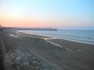sun set over Ramsey harbour and the north of the Isle of Man