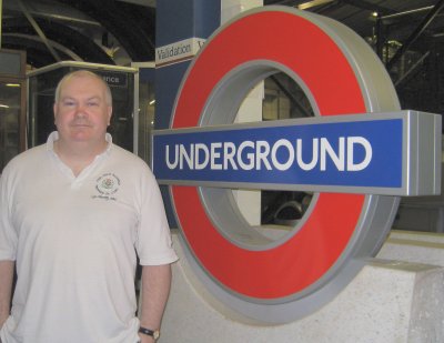 John next to the London Underground logo