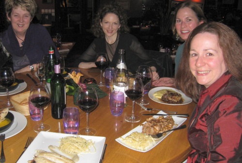 friends enjoying a meal at the moulin de la galette