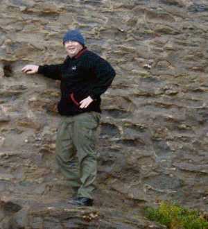 John climbs the rocks
