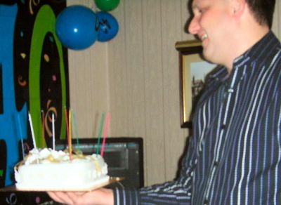 Mike holding Robbie's birthday cake