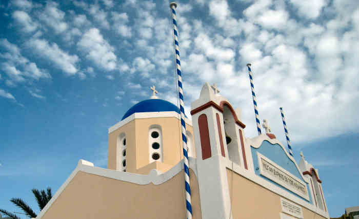 blue domed church in Santorini, Greece