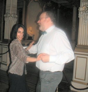 Liverpool John and Houria dance in the ballroom
