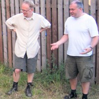 Brothers, John and Alan putting up a tent