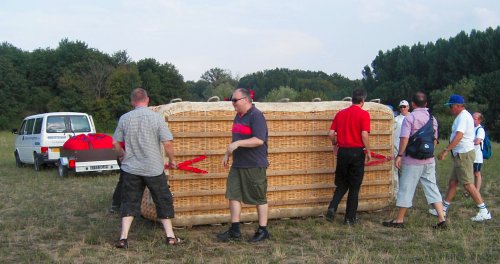 John and the other men helped lift the basket off the trailer.