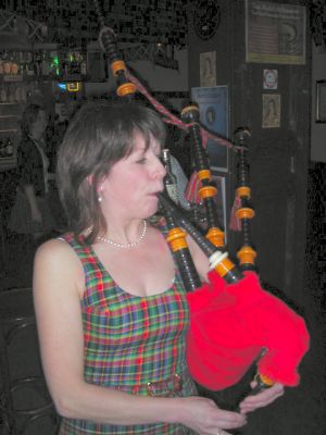 Maggie plays the bagpipes