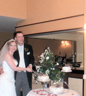 Margaret & Stu cutting the wedding cake Valentine's Day 2003