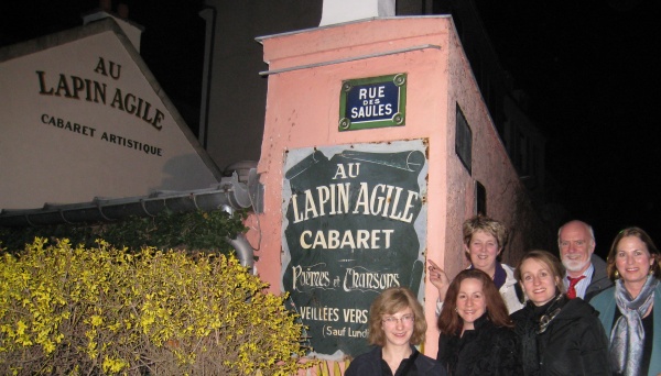outside the cabaret Au Lapin Agile in Montmartre Paris