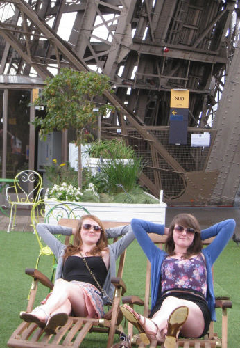 catching the rays on the first floor of the Eiffel Tower.
